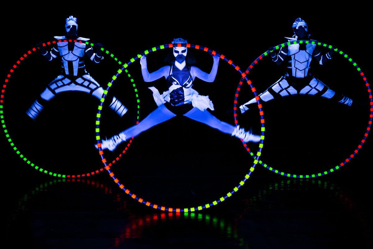 acrobats with Cyr Wheel - UV LED Light Show - Anta Agni acrobatic performance