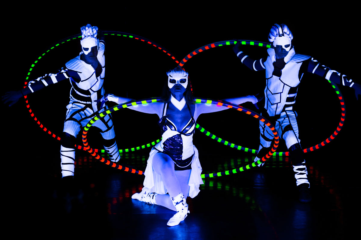 acrobats with Cyr Wheel - UV LED Light Dance Show - Anta Agni acrobatic performance