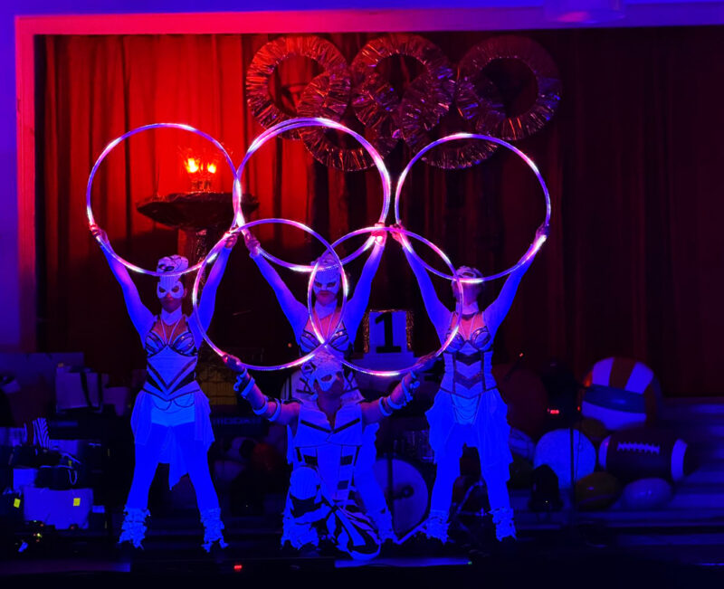 Anta Agni performers with LED hoops forming Olympic rings at Narnia School ball